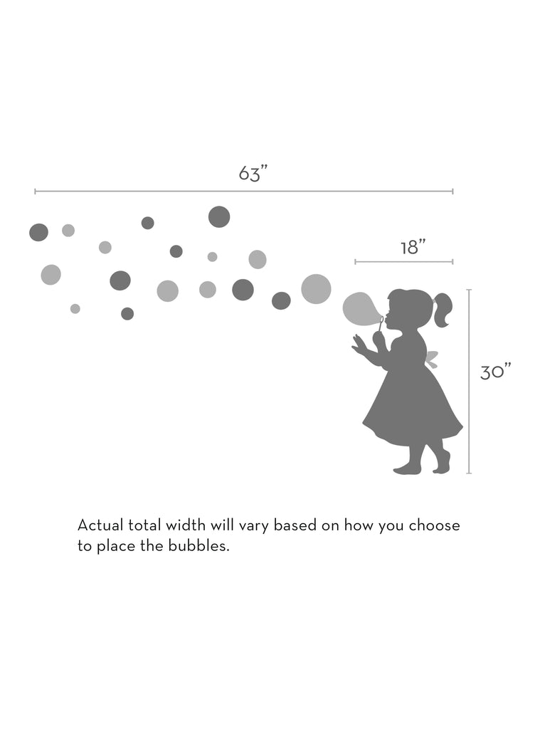 A whimsical silhouette of a child in a dress blowing bubbles, creating a playful trail of floating circles across the wall. Large-scale vinyl wall decal measuring 63 inches wide with varying bubble sizes. Perfect nursery or playroom decoration. Bubble Girl Decal - Children's Vinyl Wall Decal. Wall Decals, Baby Nursery and Kids Wall Decals, All Products.