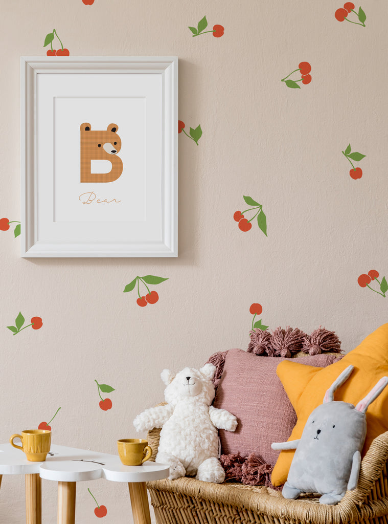 Vibrant cherry decals adorn the wall, creating a cheerful and whimsical ambiance in this cozy space. The product's versatile color options allow for personalization, making it a perfect choice for any nursery or children's room. This charming wall decal offers a touch of natural sweetness to the decor, complementing the plush toys and warm tones of the room. An eye-catching and practical addition to any Shopify product lineup, this Cherry Fruit W