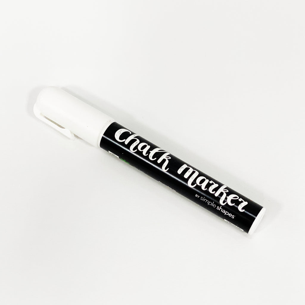 Elaborative Alt Text: The image shows a white chalk marker with the text "Chalk Marker" printed in bold black lettering. This high-quality chalk ink marker is perfect for use with chalkboard wall decals, providing a smooth, non-smearing writing experience without any dust. The marker's 6mm tip creates a fluid, medium-sized stroke, making it a versatile choice for various chalkboard projects. Ideal for Top Sellers, Back To School, and Dorm Room Id